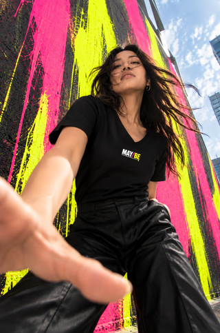 MAY/BE V-neck tee lifestyle image — GIRLFINITY identity tee